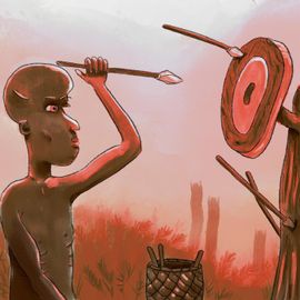 Un garçon se concentre pour que sa flèche touche la cible qui se situe à 50 centimètres de lui.