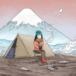 Une femme en camping se tient chaud avec un bol de nouilles. Le Mont Fuji est juste derrière sa tente.